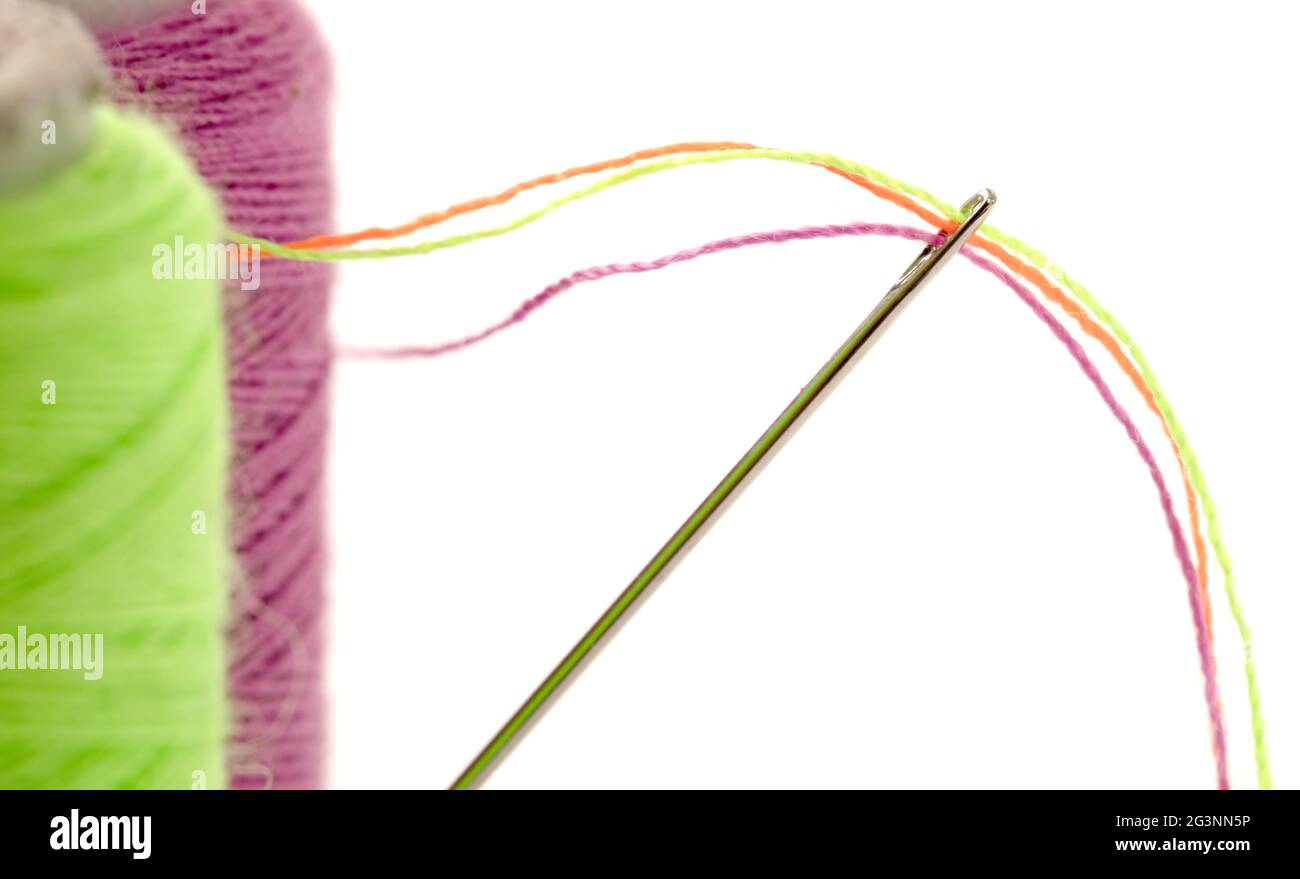 Sewing thread with needle Stock Photo Alamy