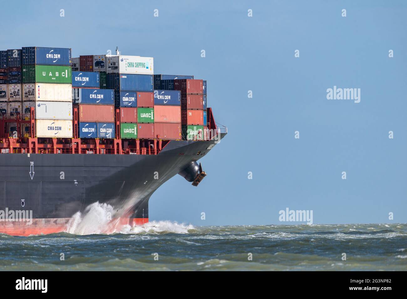 A close view of a container ship bow crashing through waves with room for text- March 2016 Stock Photo