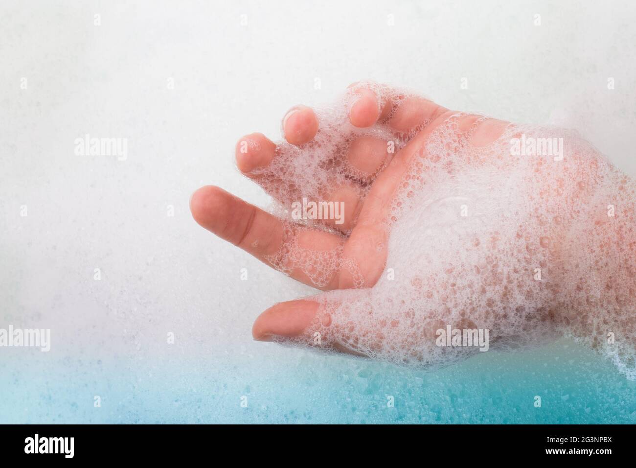 Child washing hands  in foam Stock Photo