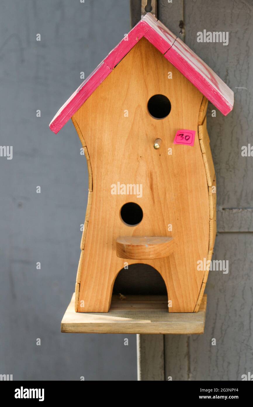 Wooden bird house with holes Stock Photo Alamy