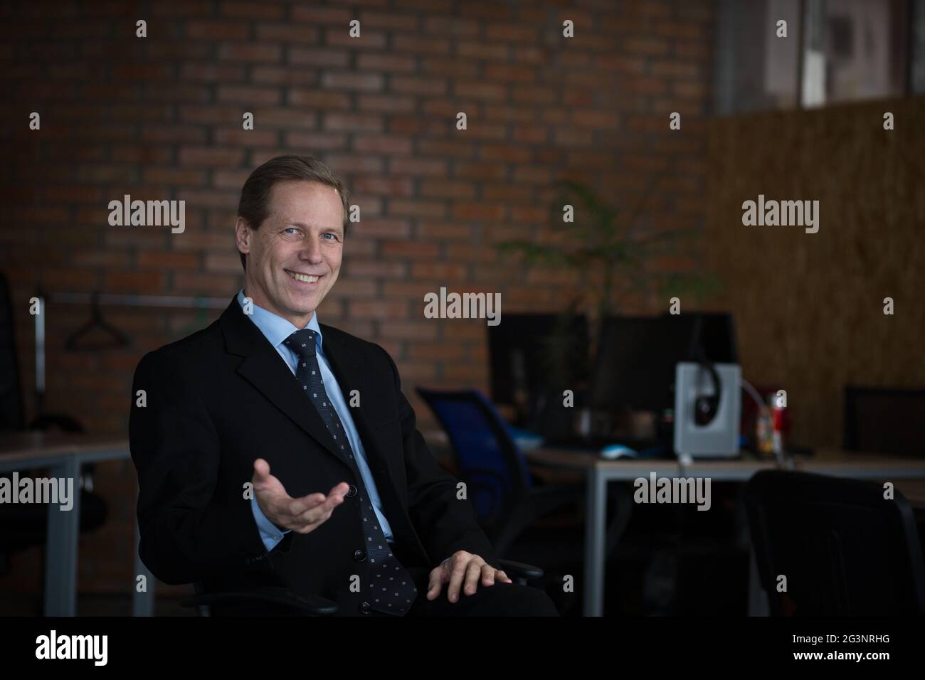 Confident adult male in suit hi-res stock photography and images - Alamy