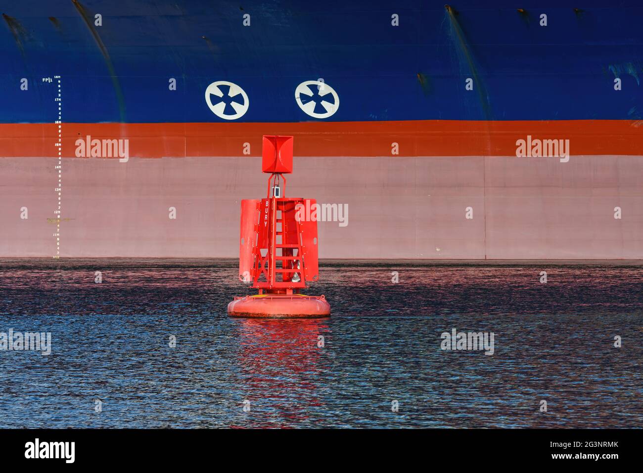 Graphic image of the waterline markings of a container ship and a red navigation buoy at the Port of Southampton - December 2020 Stock Photo