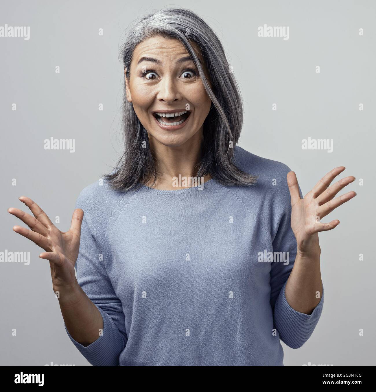 Beautiful mature woman is making funny faces Stock Photo Alamy