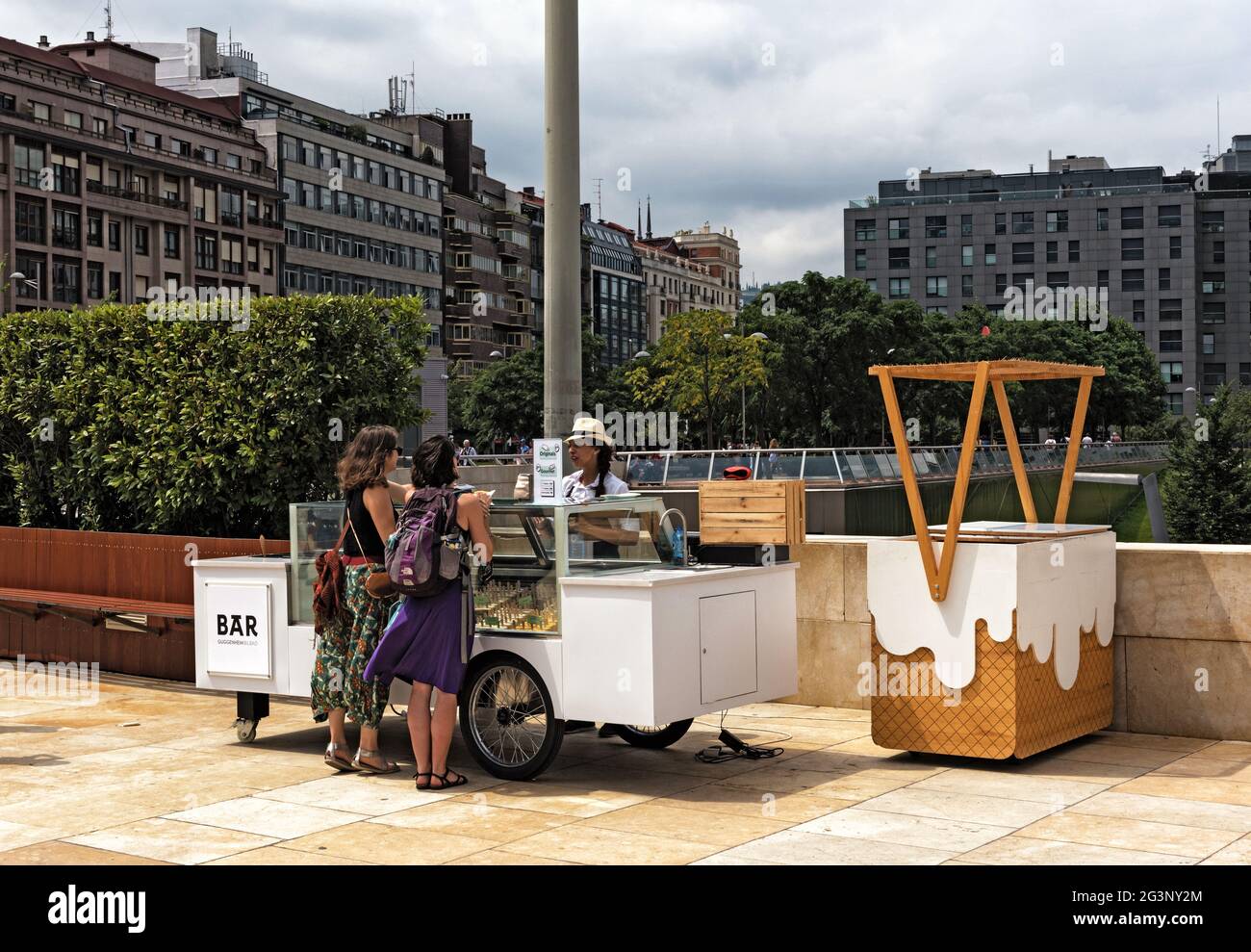Ice cream vendors and customers in the downtown area of â€‹â€‹bilbao