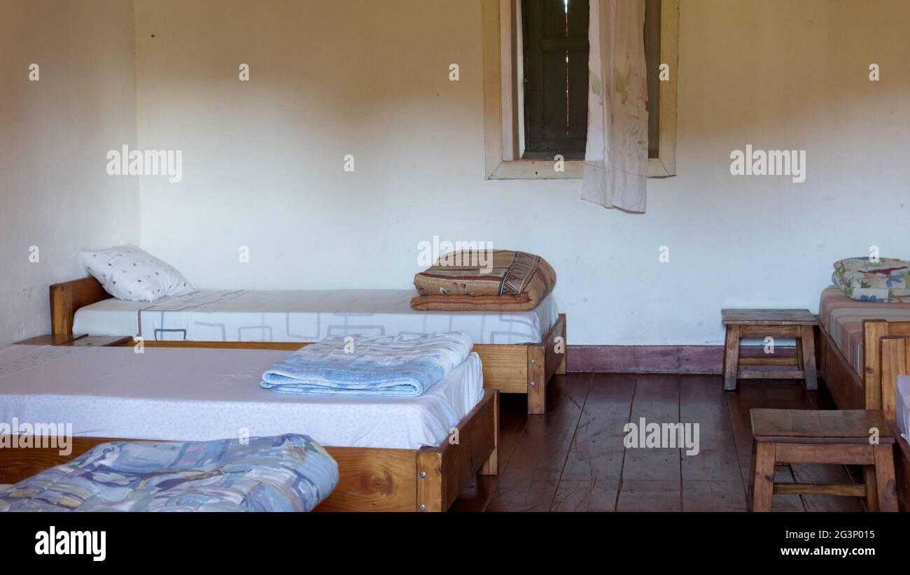 Old wooden bed (dormitory) Stock Photo