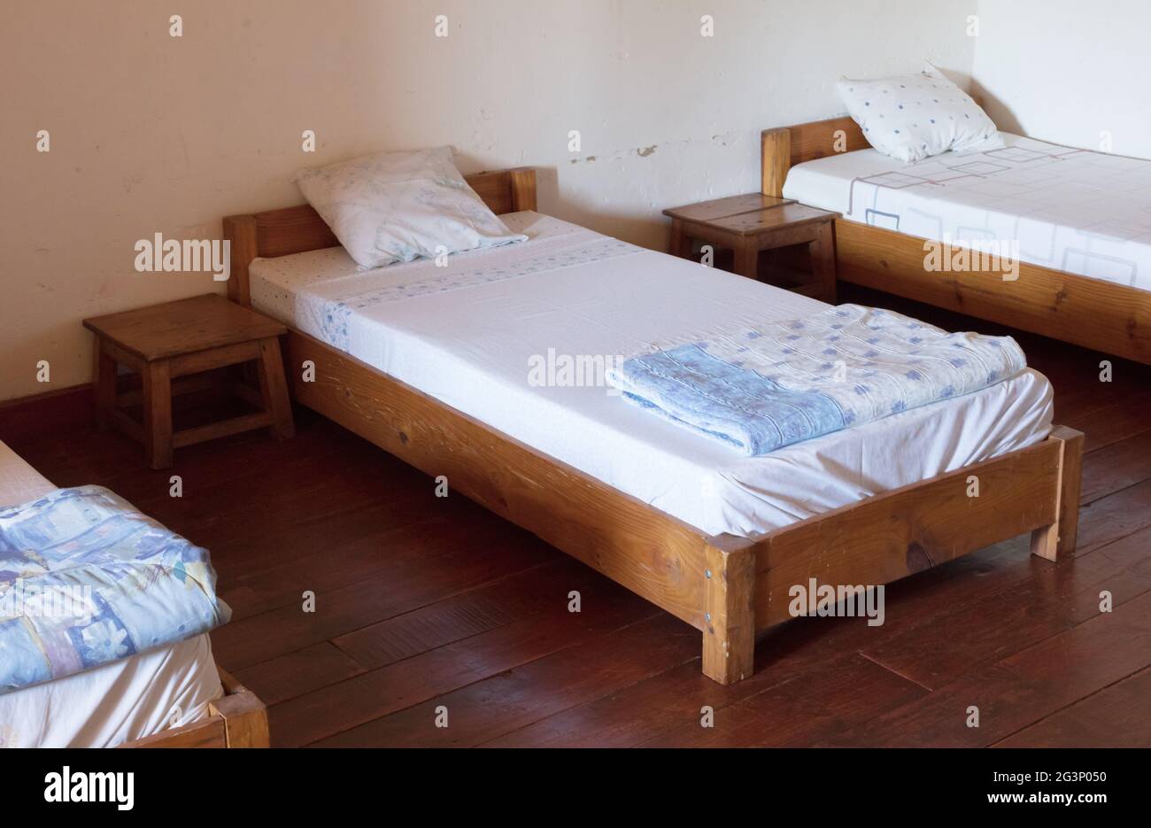 Old wooden bed (dormitory) Stock Photo