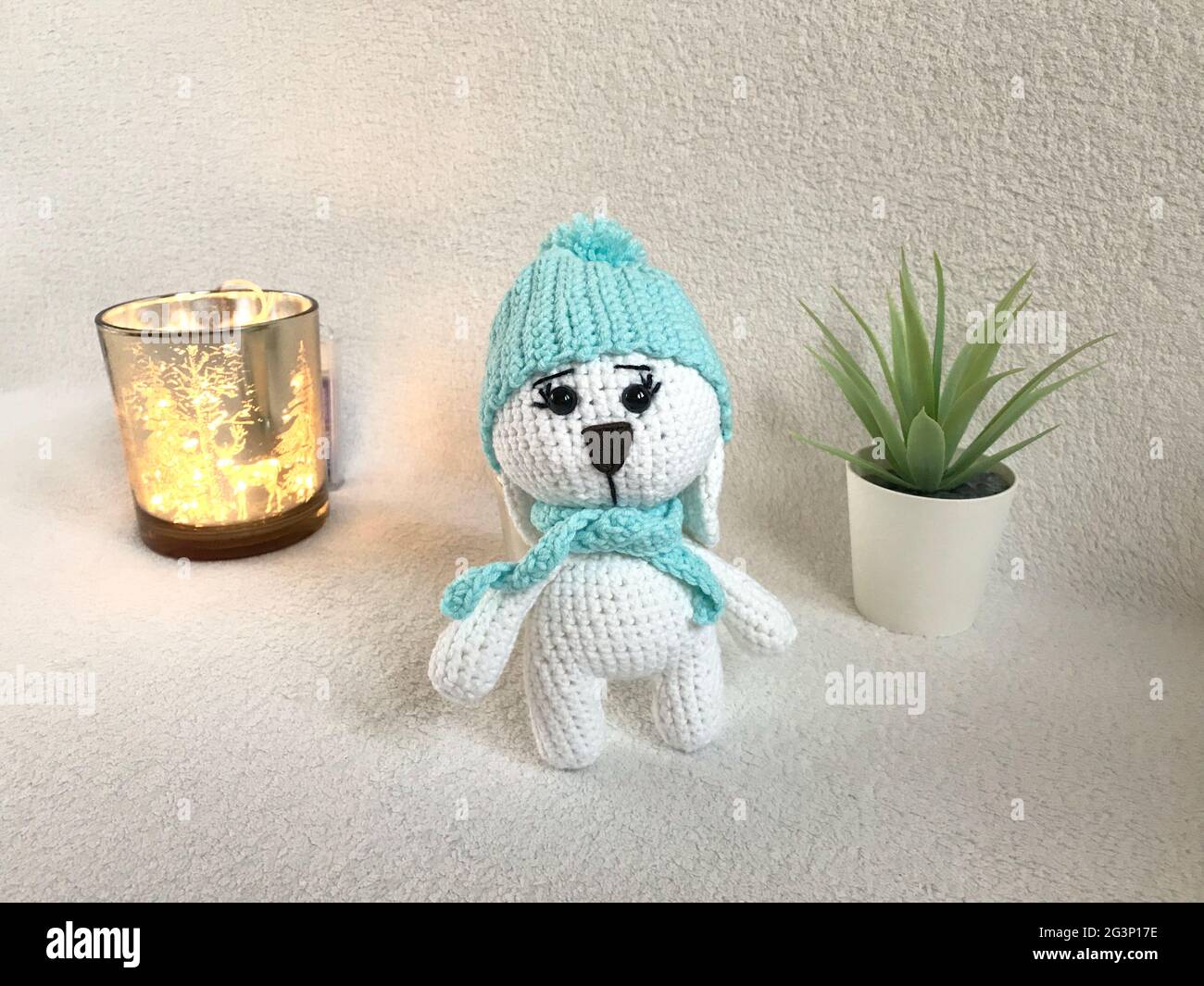 Handmade Crochet Animal Toy - Amigurumi Stuffed Toy - Cute Bunny with a Hat and Scarf Stock Photo