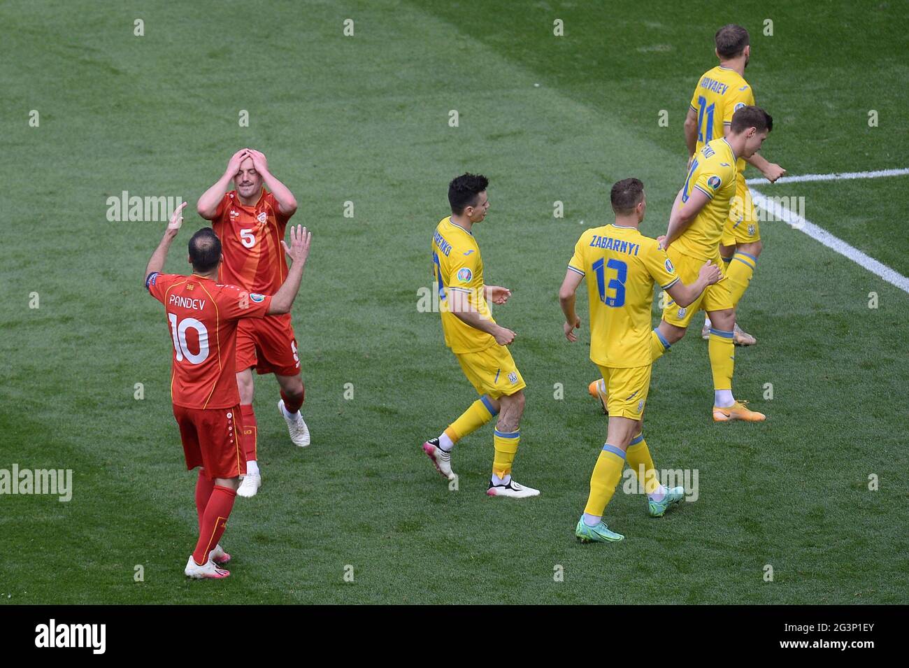 Arijan Ademi and Goran Pandev of North Macedonia are dejected during the UEFA Euro 2020 Championship Group C match between Ukraine and North Macedonia at National Arena on June 17, 2021 in Bucharest, Romania BUCHAREST, ROMANIA - JUNE 17: Stock Photo