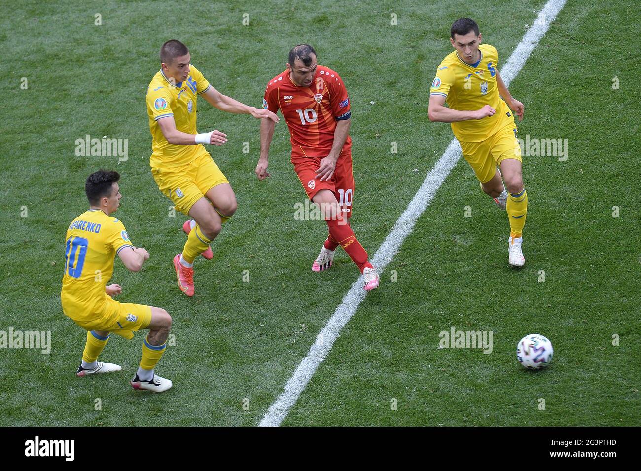 Goran Pandev of North Macedonia is closed down by Mykola Shaparenko [left] Vitaliy Mykolenko [centre] and Taras Stepanenko [right] of Ukraine during the UEFA Euro 2020 Championship Group C match between Ukraine and North Macedonia at National Arena on June 17, 2021 in Bucharest, Romania BUCHAREST, ROMANIA - JUNE 17: Stock Photo