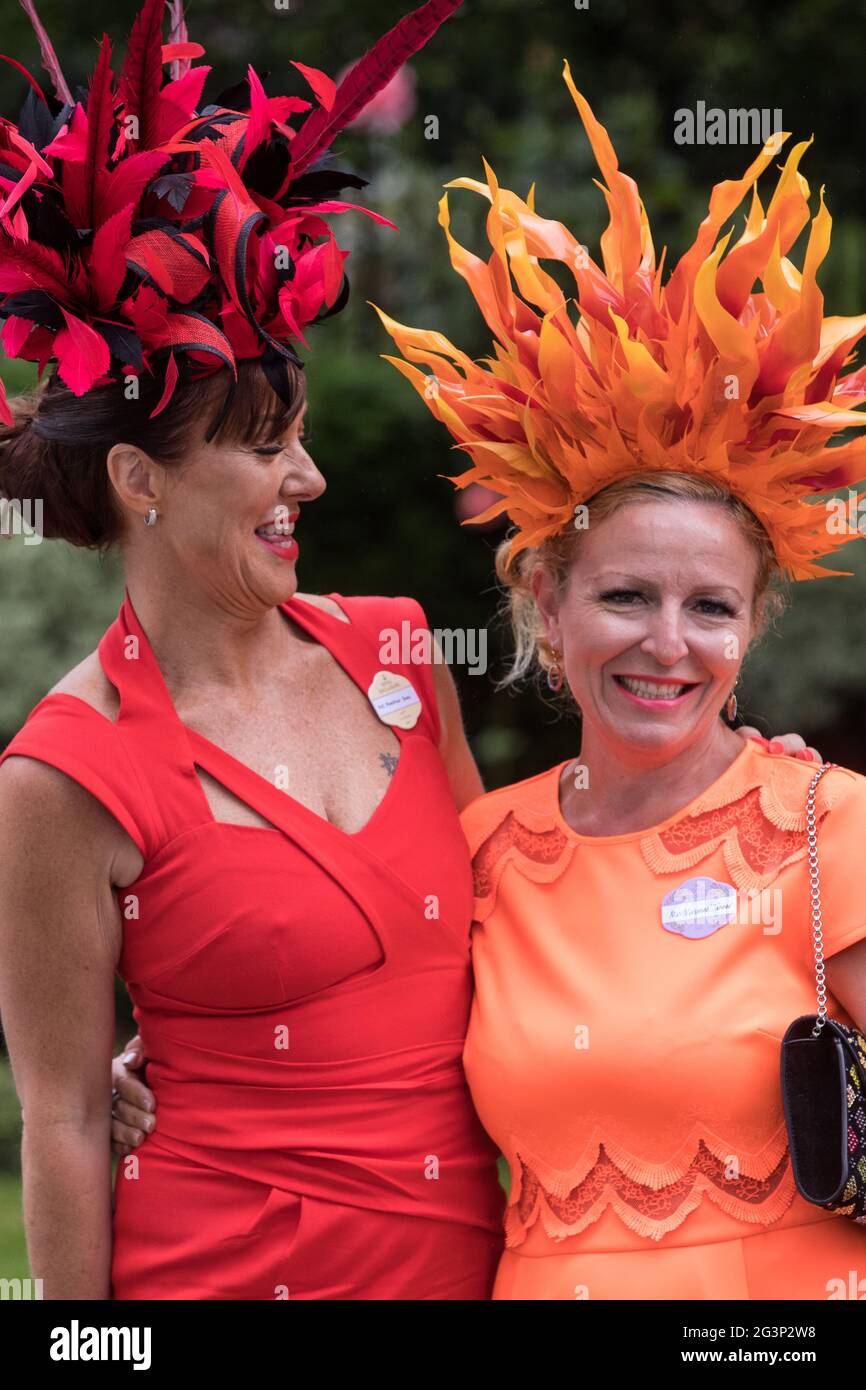 Ascot, UK. 17th June, 2021. Racegoers arrive on Ladies Day at Royal Ascot.  Despite Covid restrictions and changeable weather including some rain, many  racegoers displayed the elaborate hats and fascinators for which
