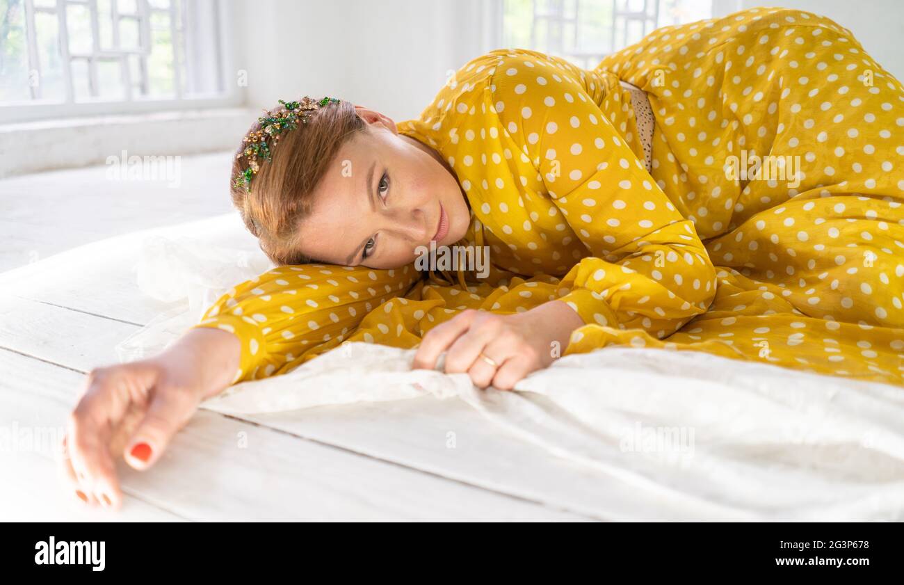Smile of a Happy Beautiful Woman Lying on Lace Layed on the Floor Stock ...