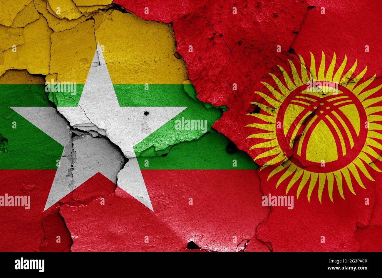 flags of Myanmar and Kyrgyzstan painted on cracked wall Stock Photo