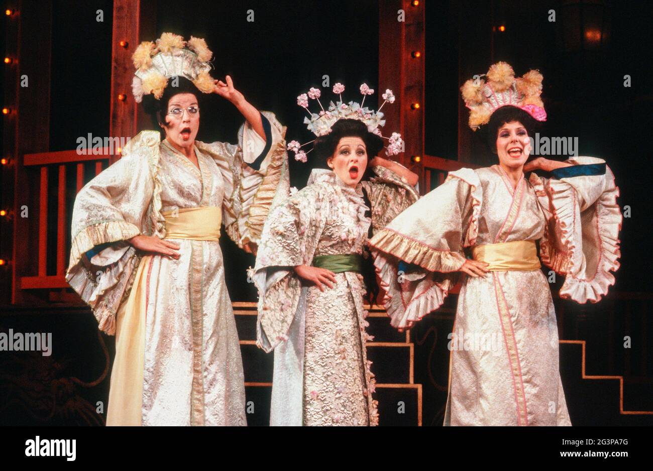 Three Little Maids - l-r: Linda-Jean Barry (Peep-Bo, Stella Goodier (Yum-Yum), Andrea Levine (Pitti-Sing) in THE MIKADO by Gilbert & Sullivan at the Cambridge Theatre, London WC2  28/09/1982  a Plymouth Theatre Royal production  set design: Sean Cavanagh  costumes: Hugh Durrant  lighting: Dee Ashworth  choreography: Michele Hardy  director: Chris Hayes Stock Photo