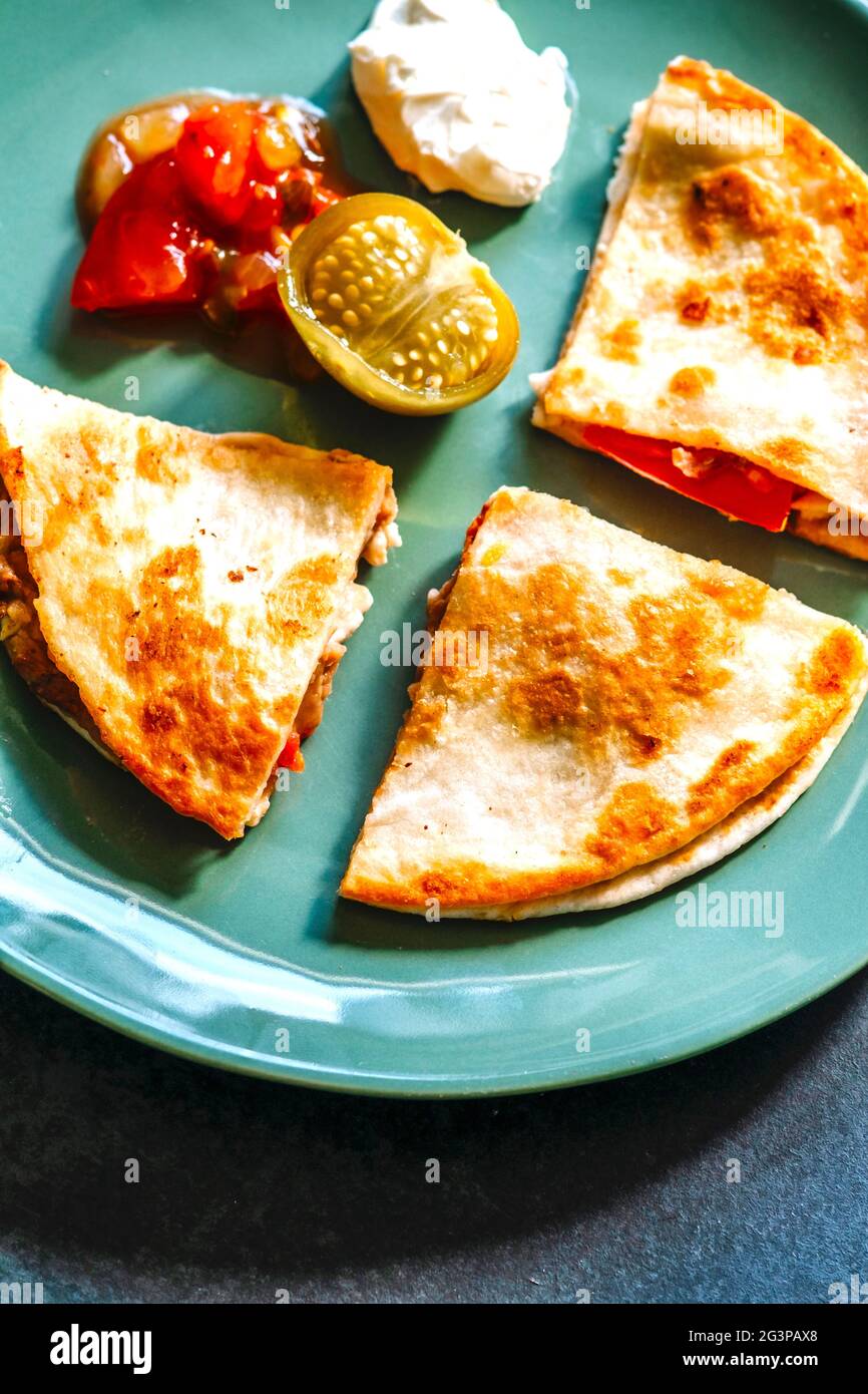 Quesadilla with Tomato Salsa, Tomatillos and Sour Cream Stock Photo Alamy
