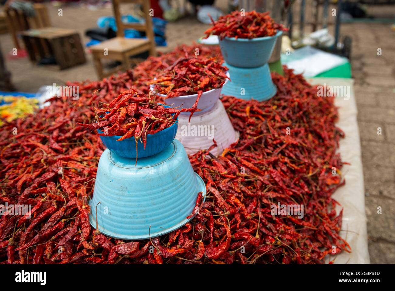 Detail of dried red chili peppers in a market stall at the town of San ...
