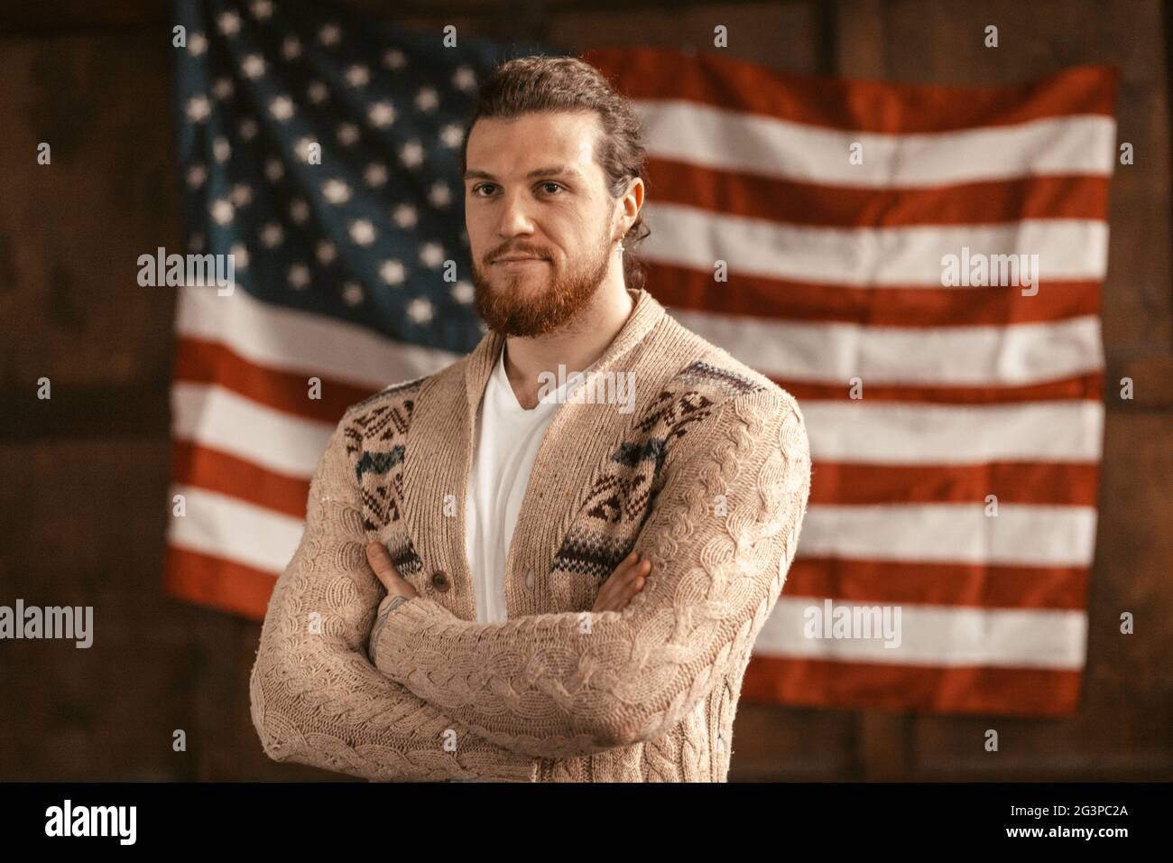 Intelligent Light-Skinned Successful American Entrepreneur On America's Flag Back Stock Photo