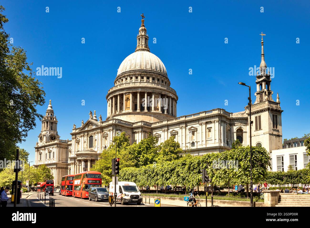 LONDON ENGLAND ST. PAULS CATHEDRAL AND  RED DOUBLE DECKER BUSES ON A SUMMER'S DAY Stock Photo