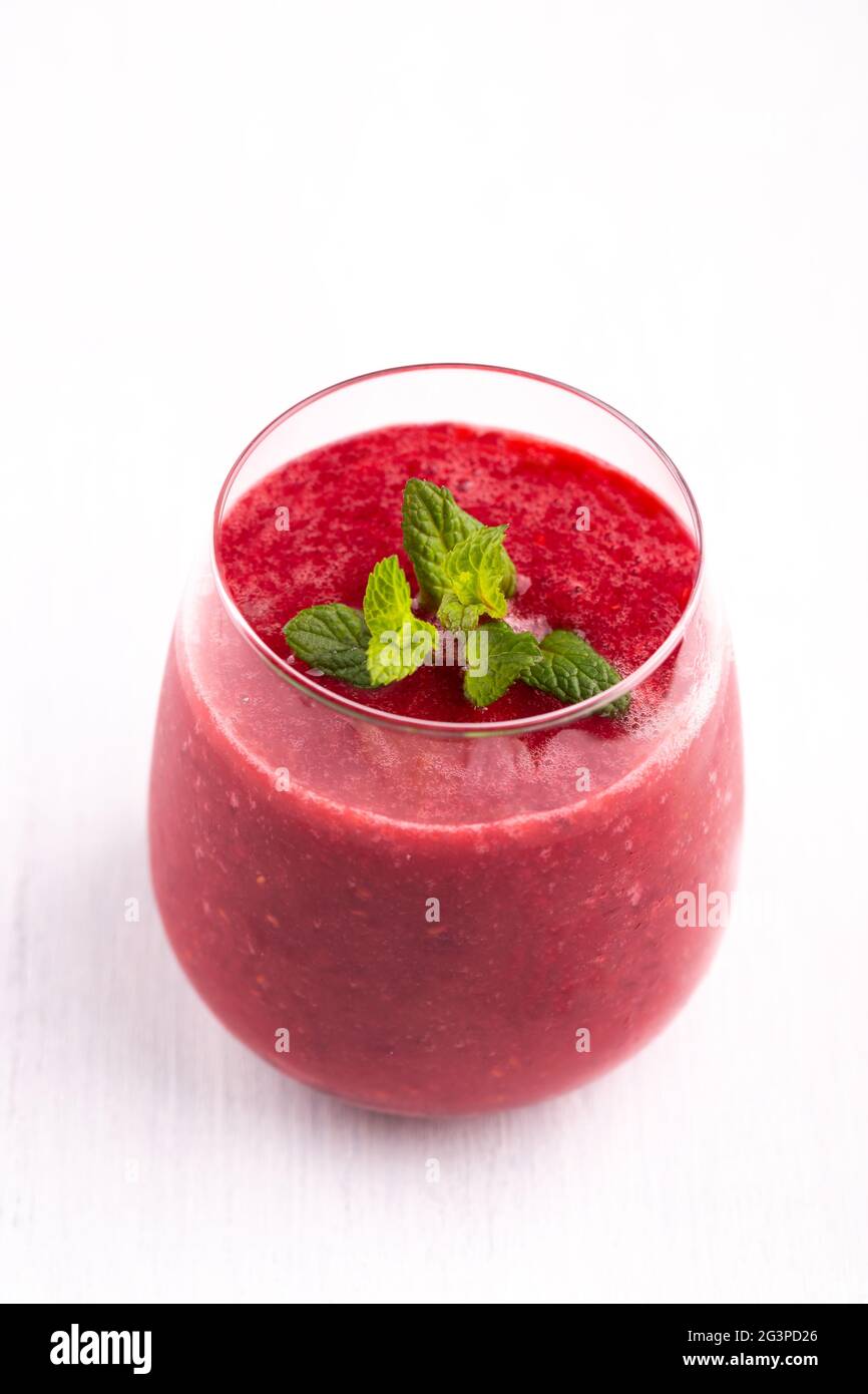 Glass of strawberry and raspberry smoothie Stock Photo