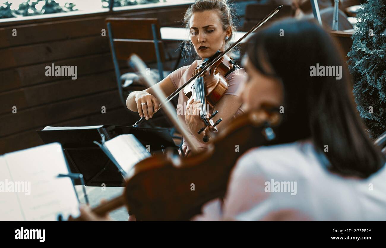 String Orchestra Female Playing Outside The Terrace Stock Photo Alamy