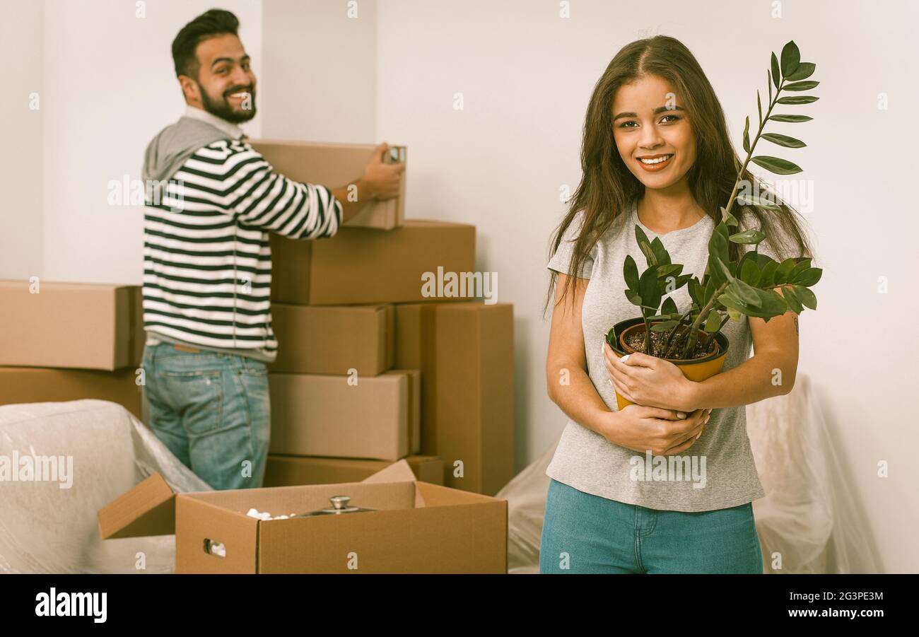 Happy young couple moving in their new home Stock Photo