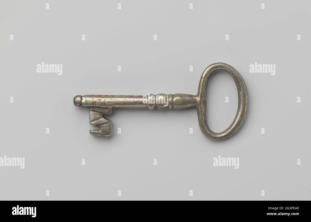 Key. Key with oval eye, simple profiled shaft that goes past the beard ...
