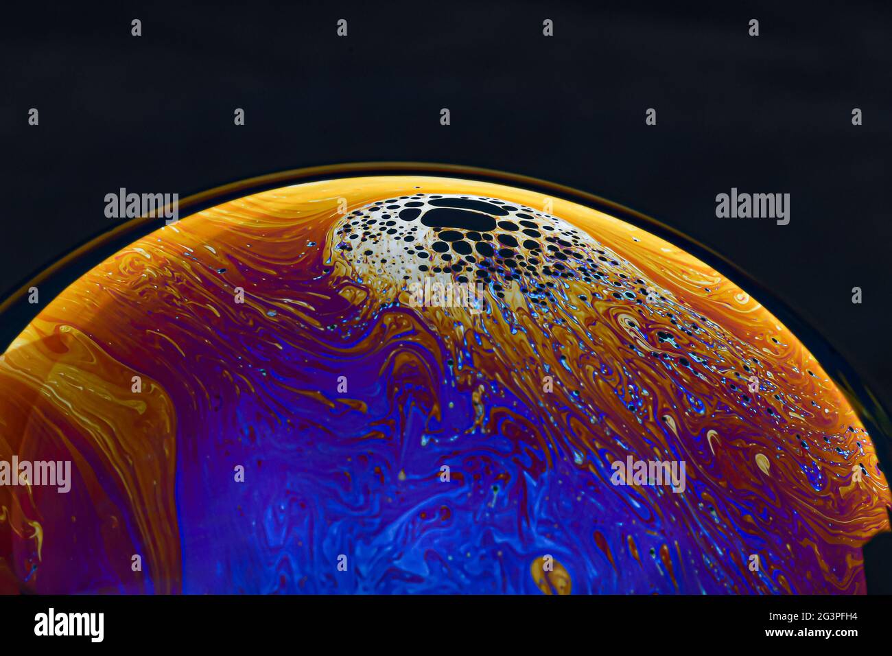 Beautiful psychedelic abstractions on the surface soap bubbles. Stock Photo