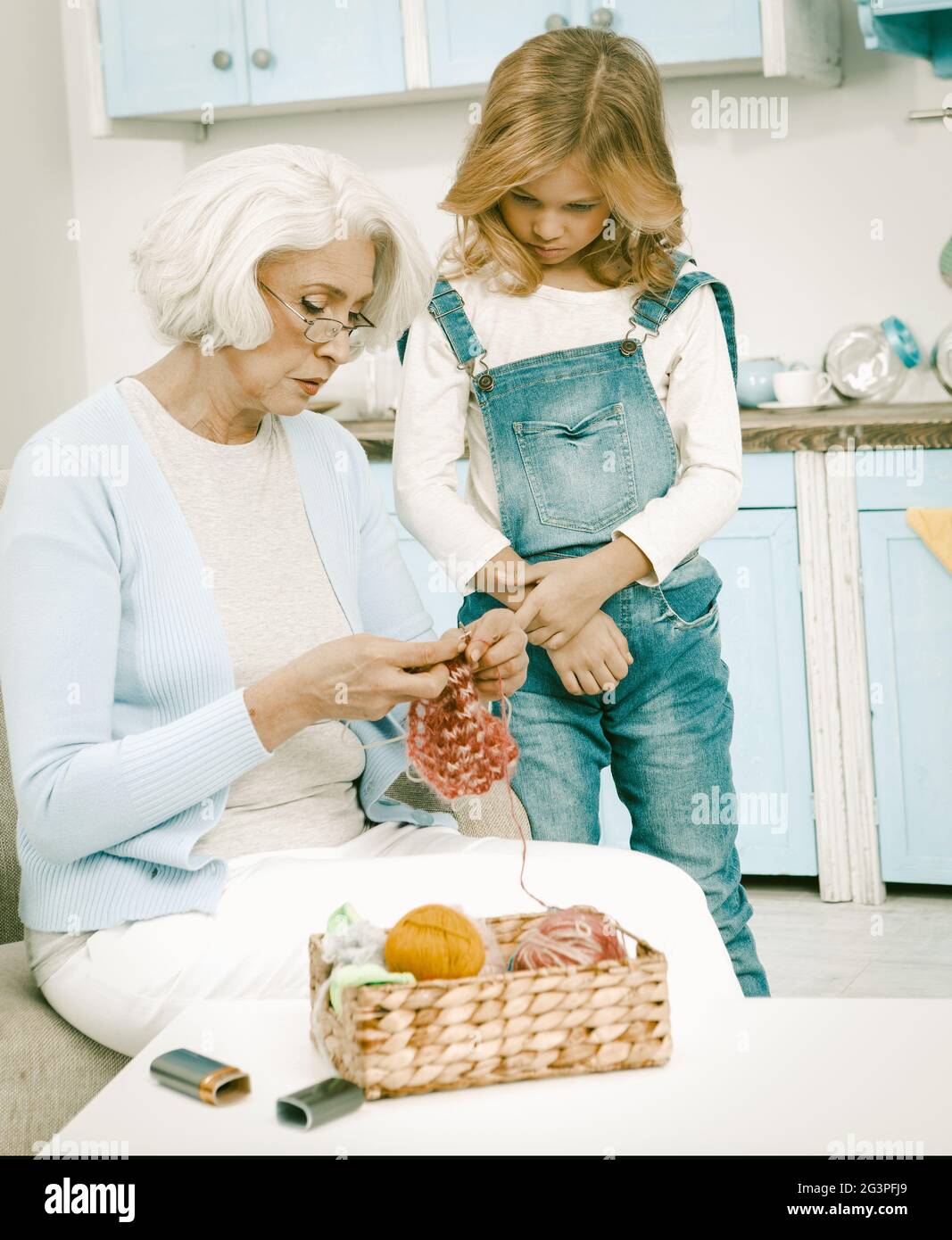 Grandma And Her Grandchild Knitting Fun Together Stock Photo