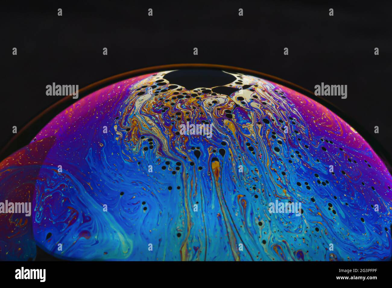 Beautiful psychedelic abstractions on the surface soap bubbles. Stock Photo