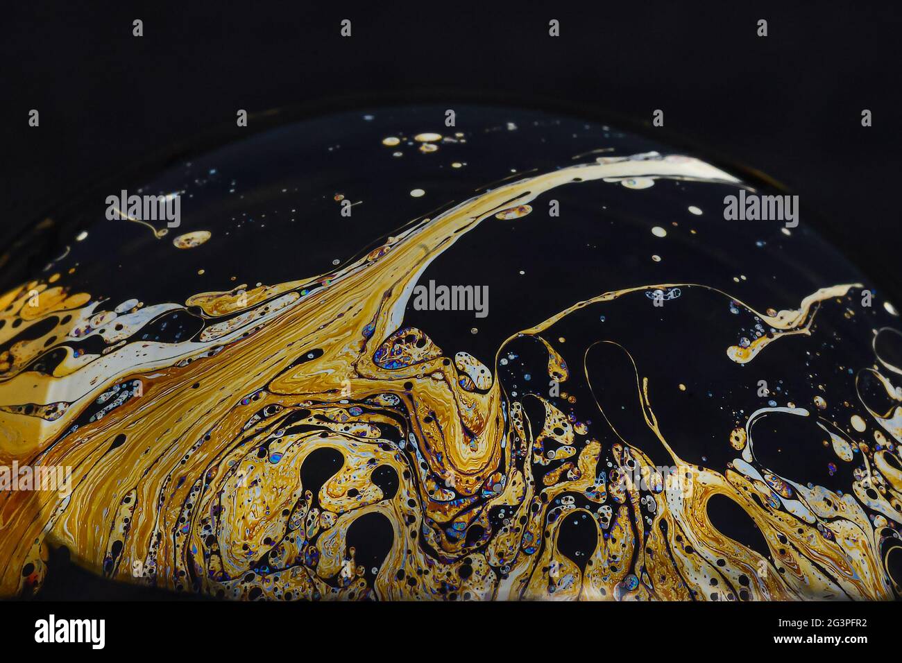 Beautiful psychedelic abstractions on the surface soap bubbles. Stock Photo