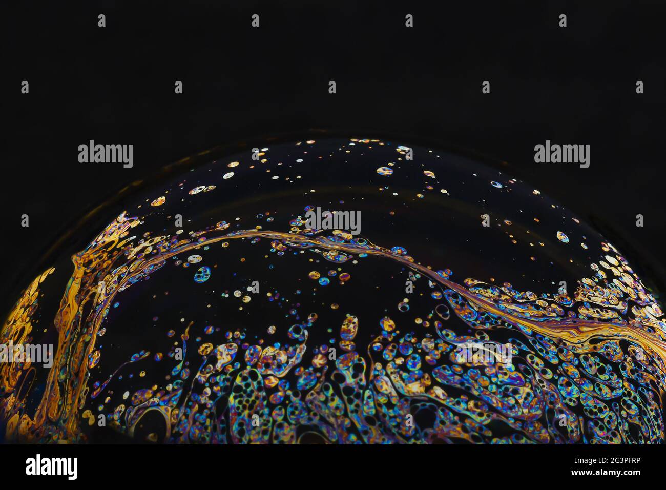 Beautiful psychedelic abstractions on the surface soap bubbles. Stock Photo