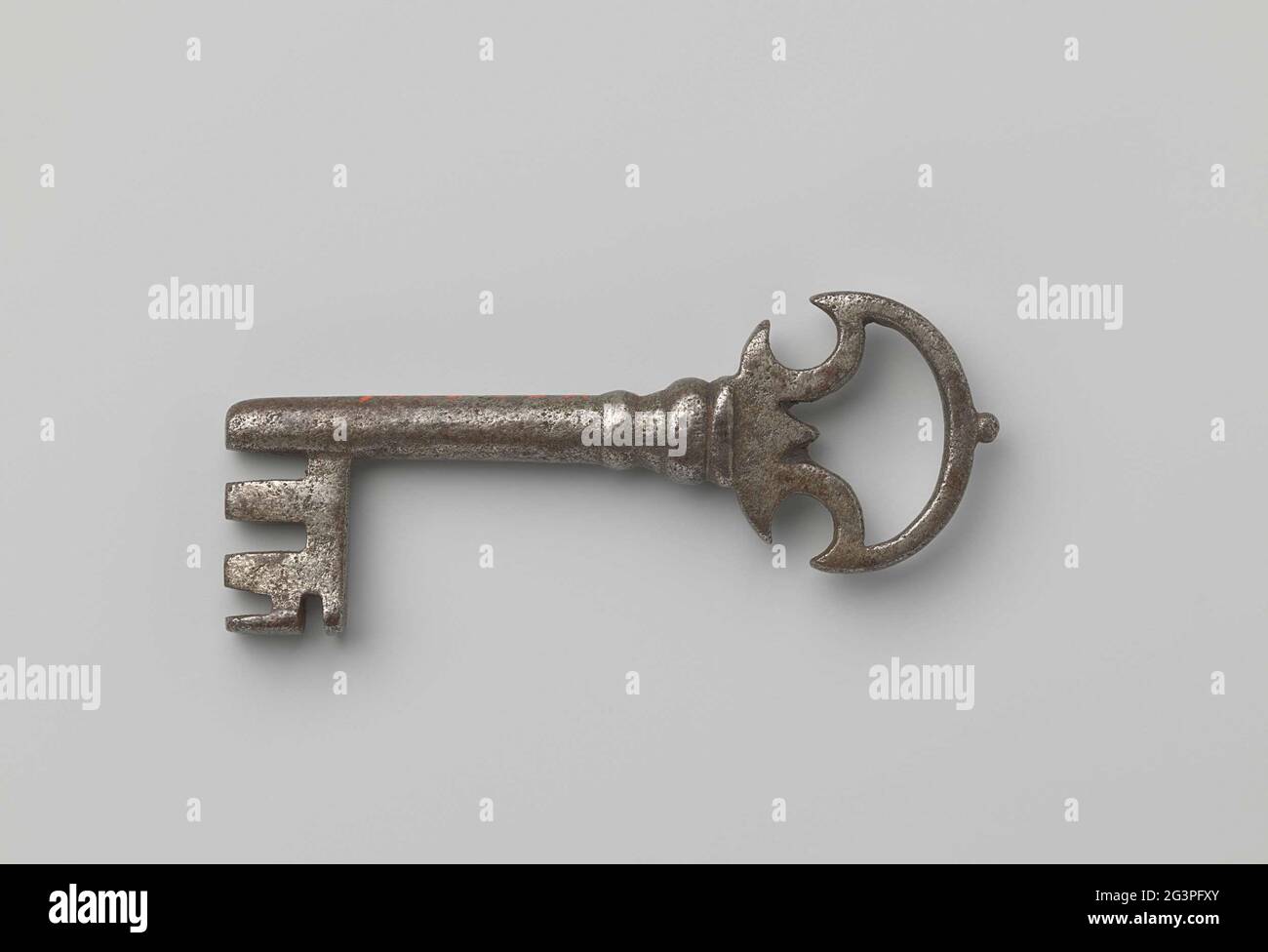 Key. Key with bracket-shaped eye awarded by a button Stock Photo - Alamy