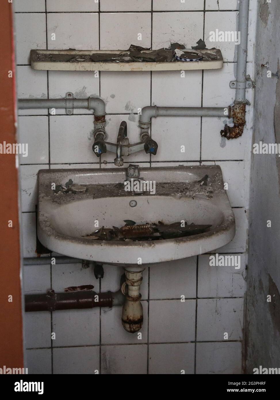 Dirty sink with water connection Stock Photo