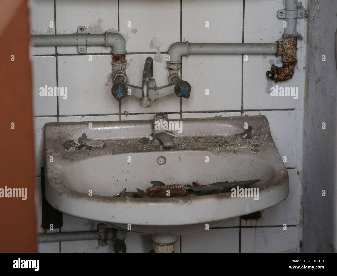 Dirty sink with water connection Stock Photo