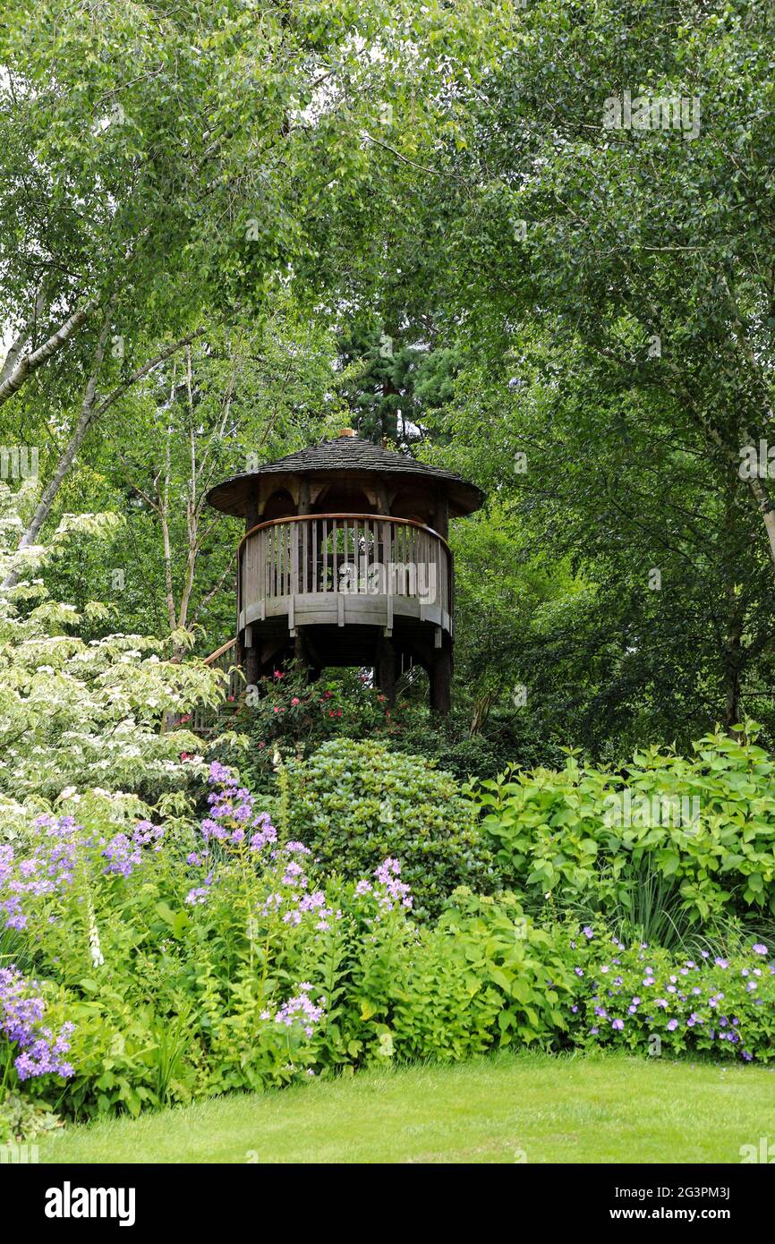 A tree house at Foggy Bottom at Bressingham Steam & Bressingham Gardens, a steam museum and gardens located at Bressingham, Diss, Norfolk, England, UK Stock Photo