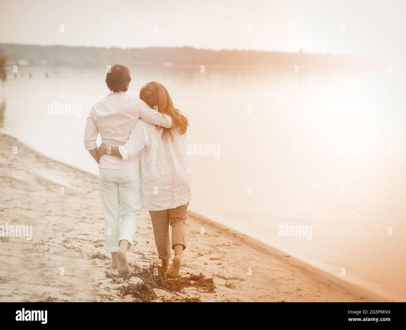 Couple walk sea, great design for any purposes. Healthy active lifestyle. Elderly couple. Blue sky. Elderly people Stock Photo