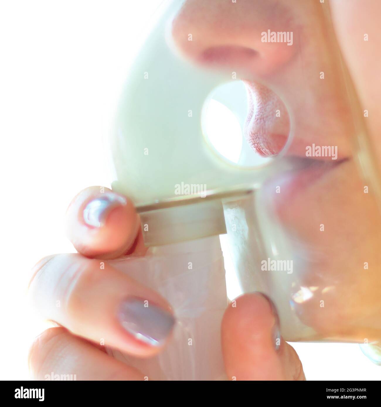 Close-up face with mask for inhaler. Prevention and treatment of colds ...