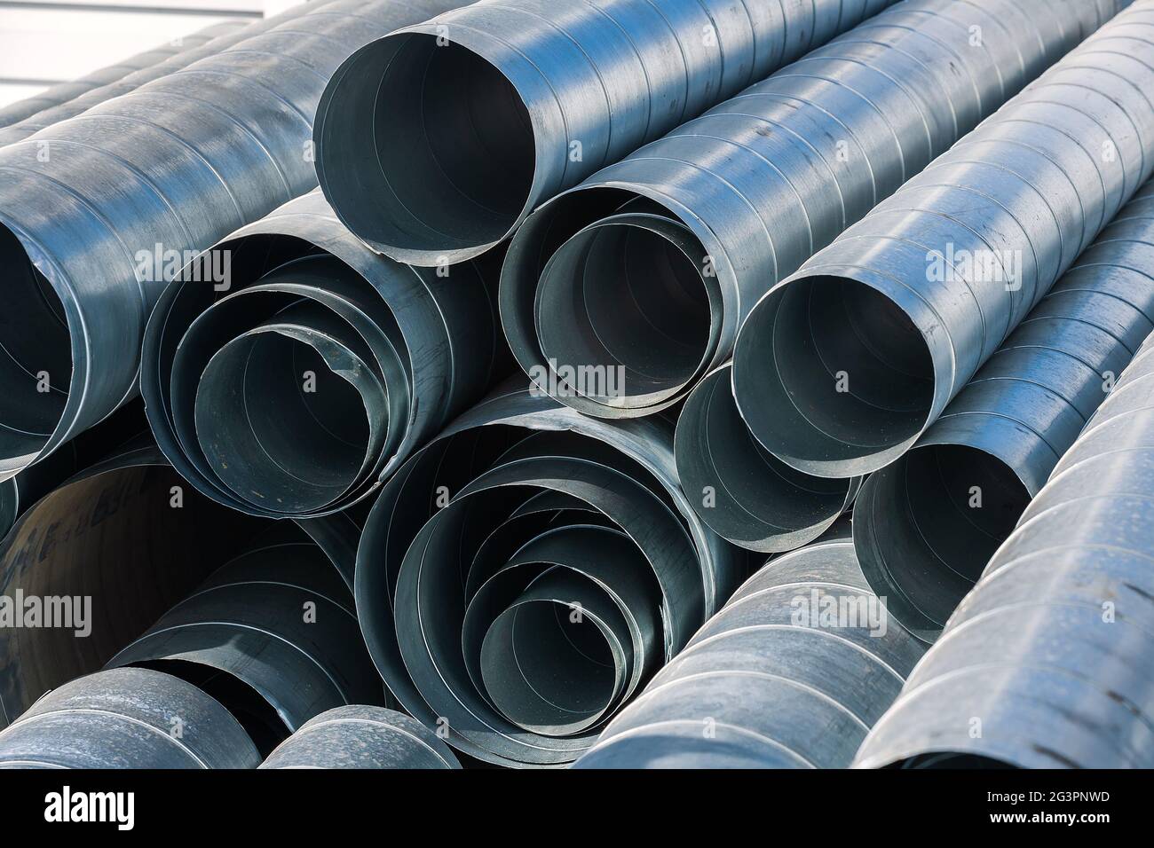 Pipes for exhaust ventilation. Background. Dismantling and construction at the facility Stock Photo