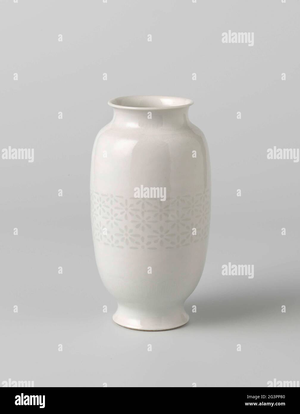 Ovoid Vase With Translucent Star Motif, Ruyi-Heads and Ornamental Borders.  Egg-shaped vase of porcelain, covered with a translucent white glaze. On  the body a wide band with glazed ajour work; Around the