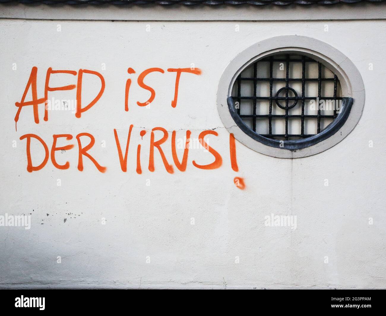 Graffiti lettering AFD IS THE VIRUS on a house wall in Magdeburg Saxony-Anhalt Stock Photo