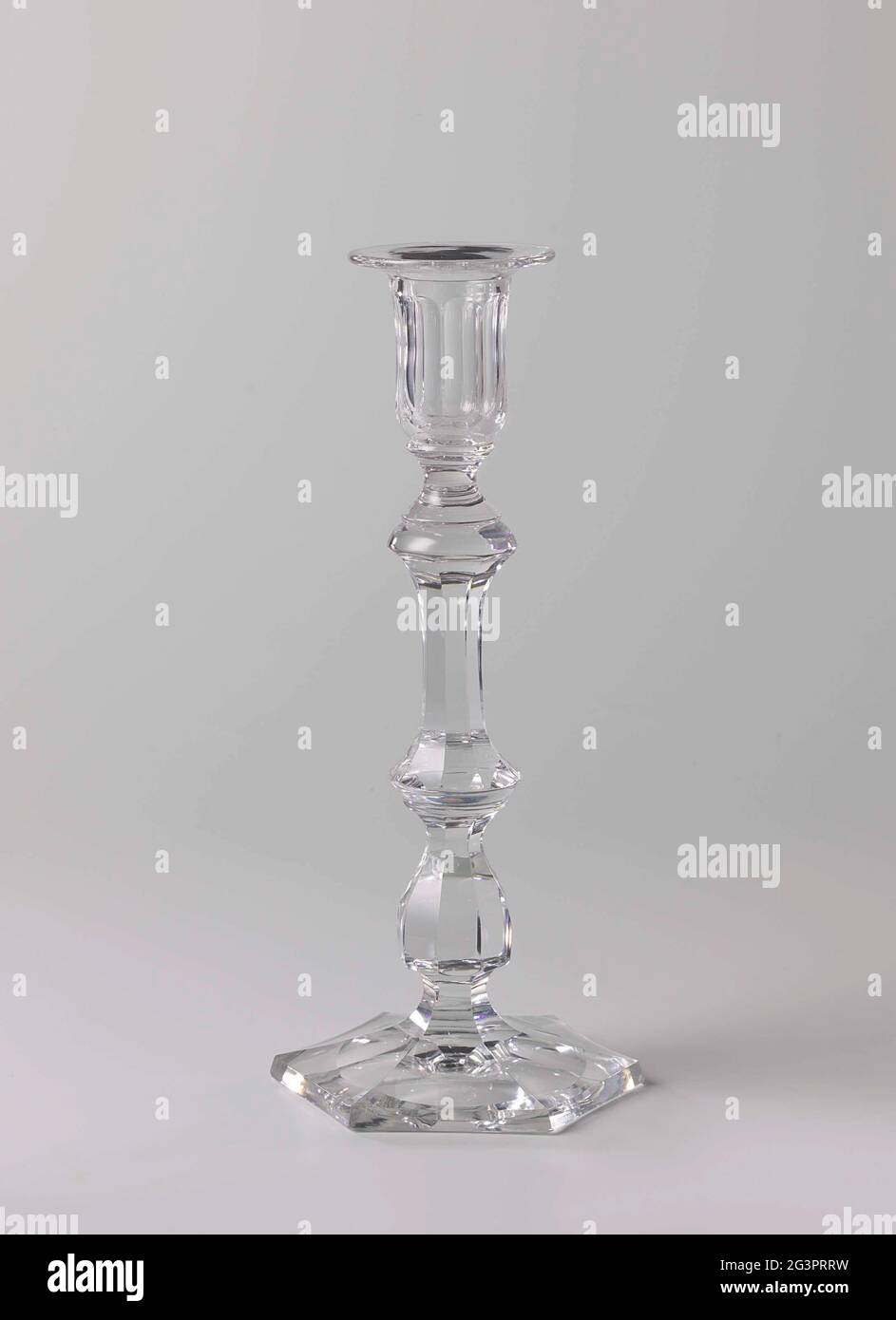 Candlestick with polished facets. Hexagonal, conical foot, baluster