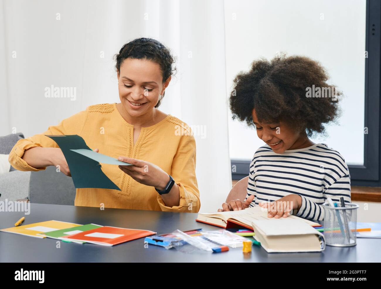 Professional child's psychologist working with an autistic girl child uses psychological session. Art psychotherapy session for autism Stock Photo
