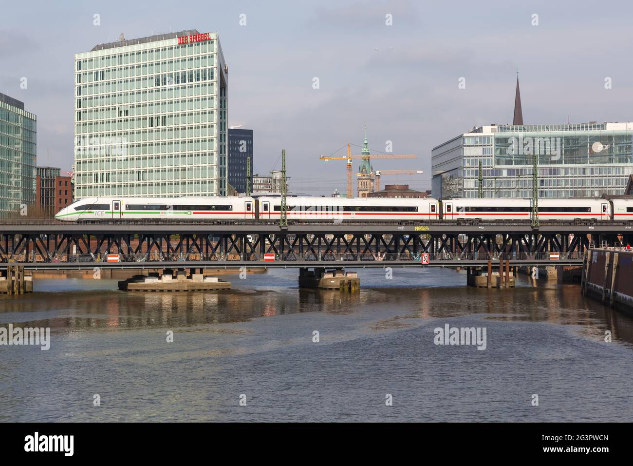Hamburg, Germany - April 21, 2021: ICE 4 high-speed train of Deutsche Bahn DB on the Oberhafen bridge in Hamburg, Germany. Stock Photo