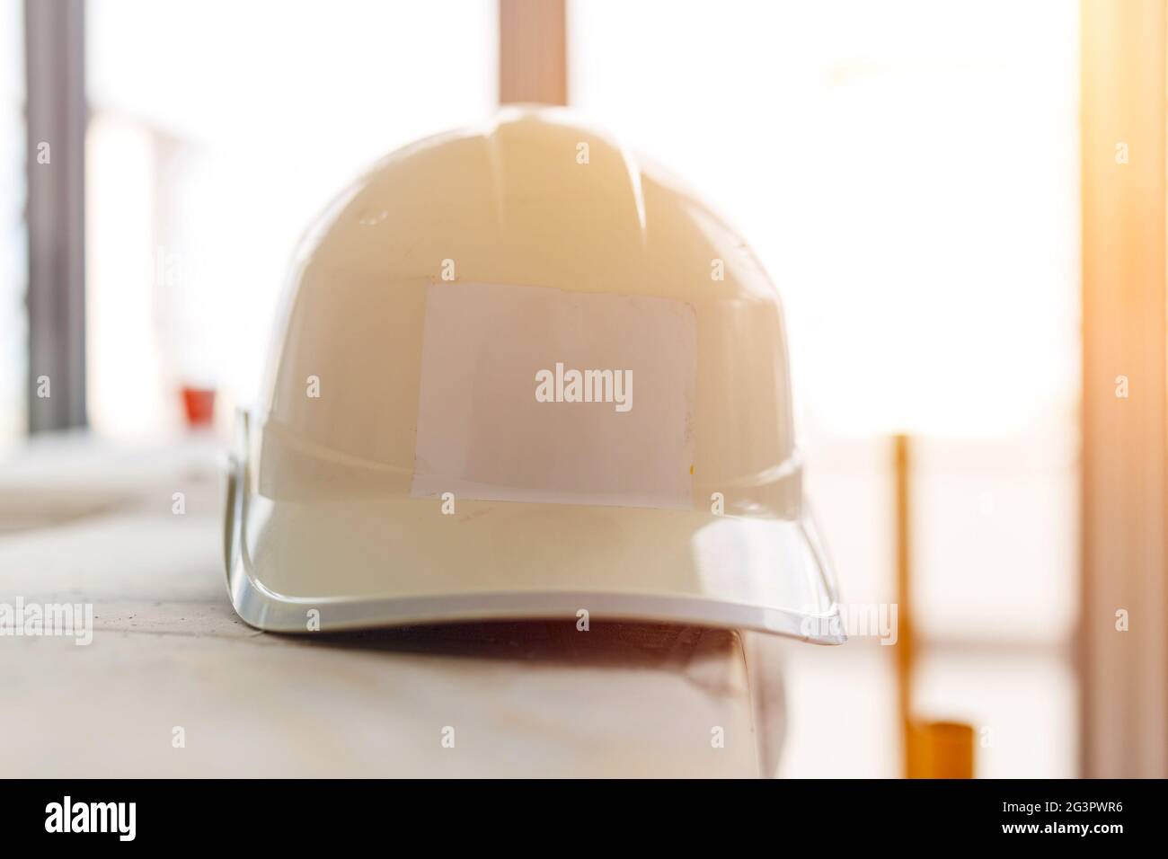 White Safety helmet at construction site Stock Photo Alamy