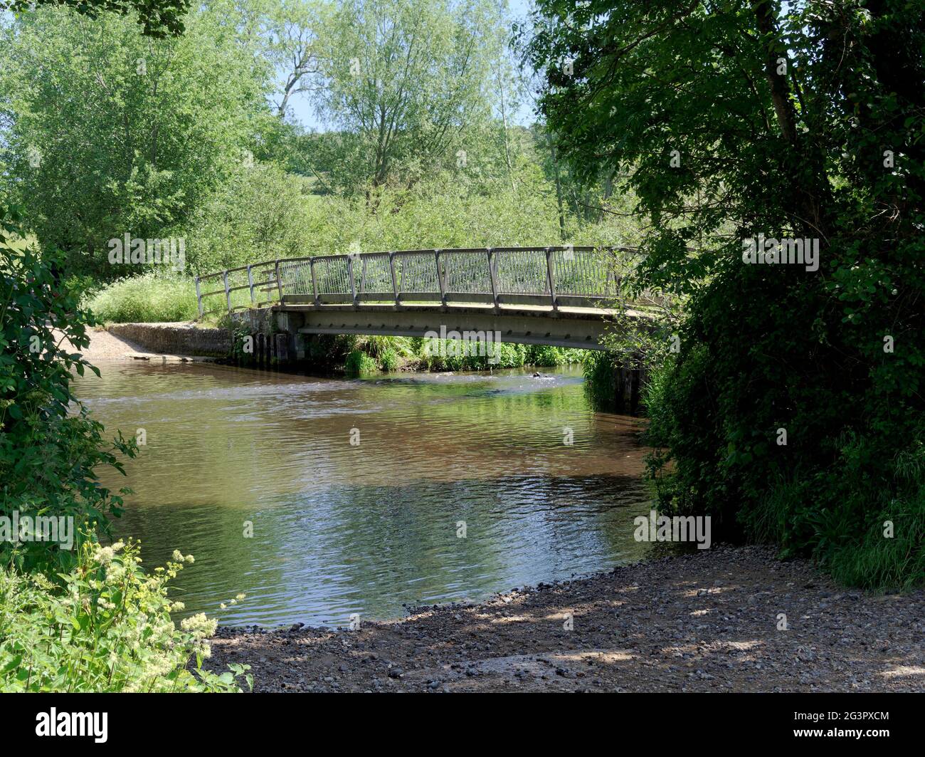 The ford and footbridge across the River Glaven on the edge of the village of Glandford in North Norfolk. Stock Photo