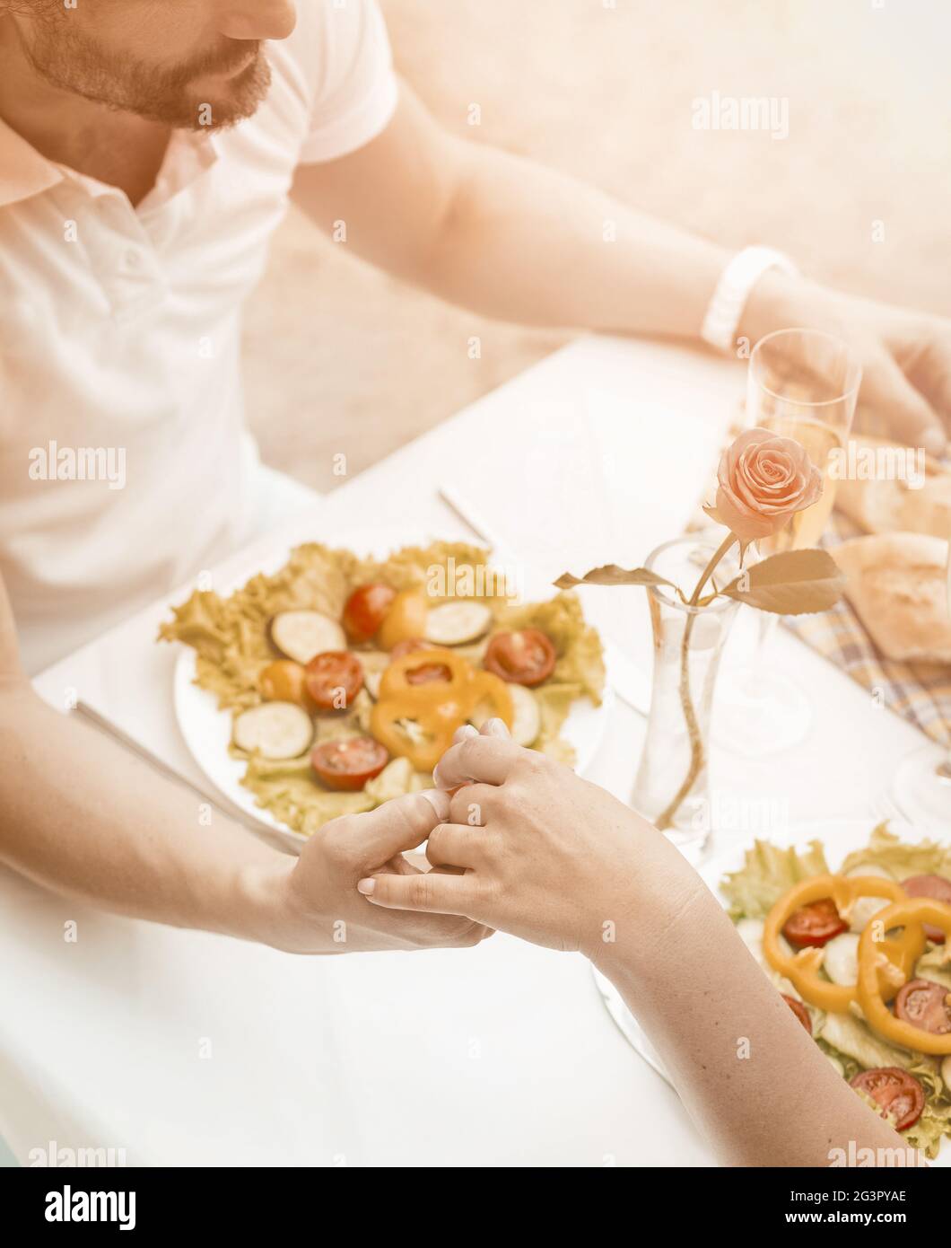 Holding hands lovely couple hi-res stock photography and images - Alamy