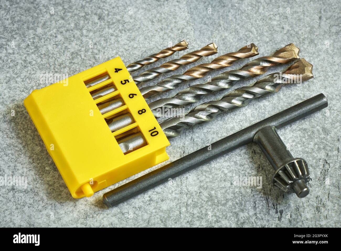 Set of various diameters of winning drills and a drill chuck wrench