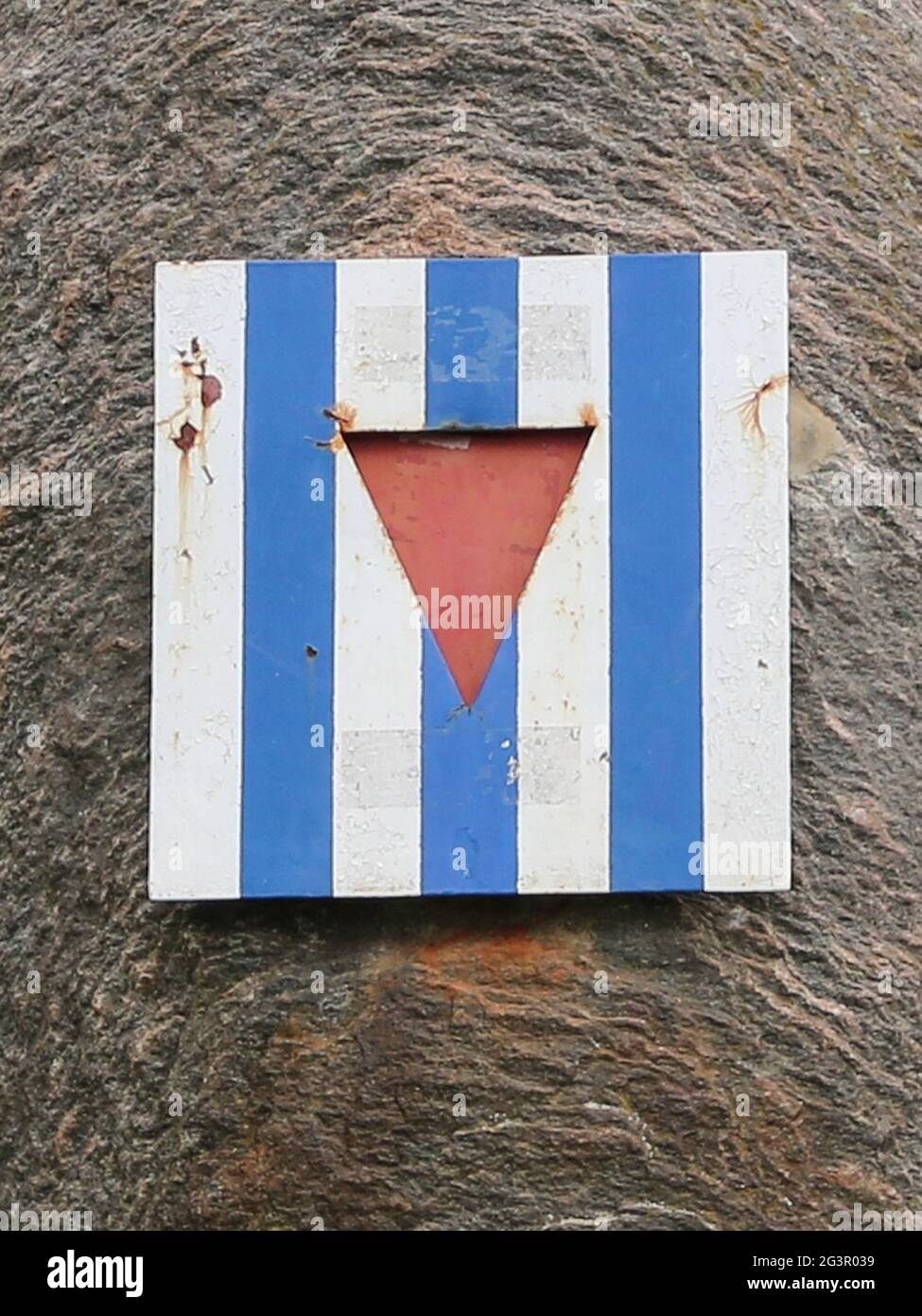 Concentration camp inmates are symbolized by a striped plate with a central triangle Stock Photo