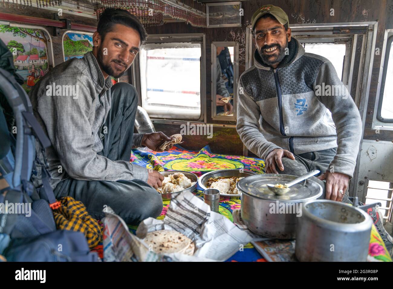 Cooking and eating view with indian drivers inside the truck Stock Photo Alamy