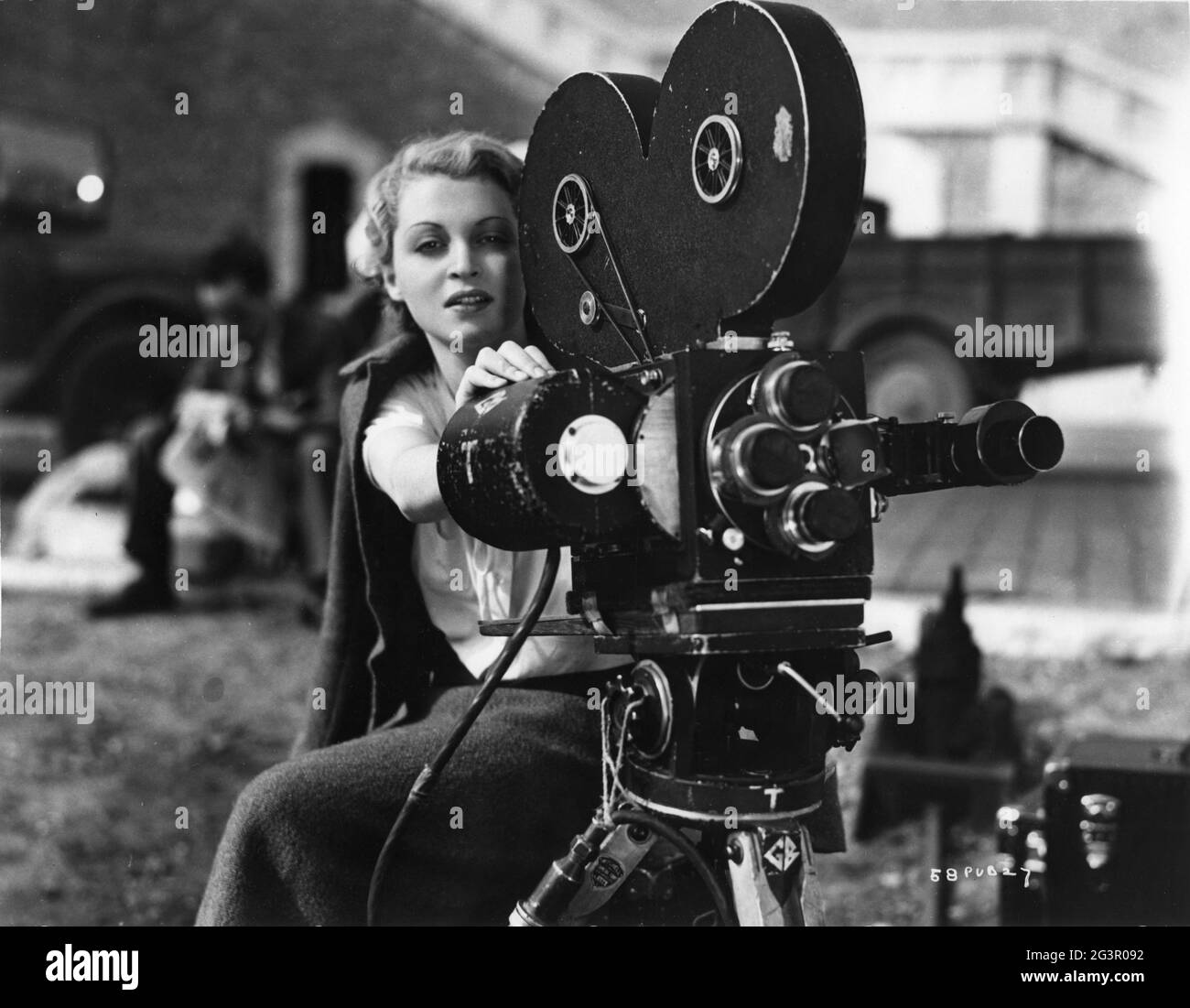 LILLI PALMER on set location candid in France with Movie Camera during filming of THE FIRST OFFENCE aka BAD BLOOD 1936 director HERBERT MASON writers Stafford Dickens Austin Melford Cinematographer Arthur Crabtree music Allan Gray and Franz Waxman producer Michael Balcon Gainsborough Pictures / Gaumont British Distributors Stock Photo