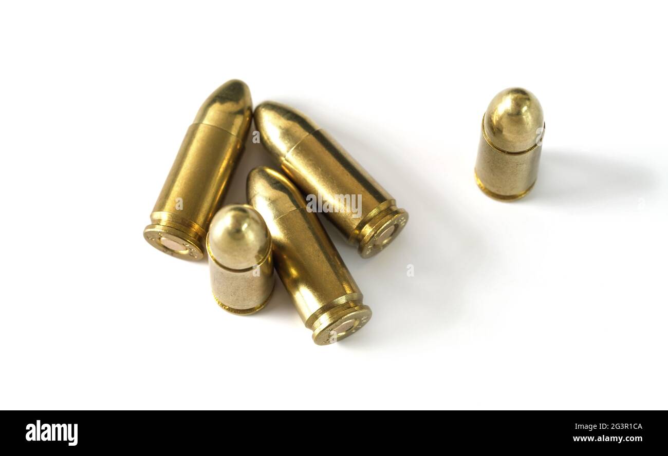 Yellow brass ammo bullets isolated on white background, view from above Stock Photo